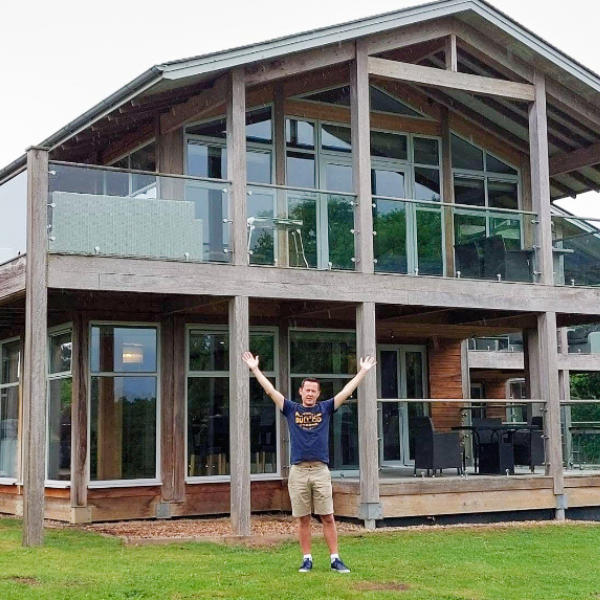 The Lodge Guys - Nick in front of lodge (square)